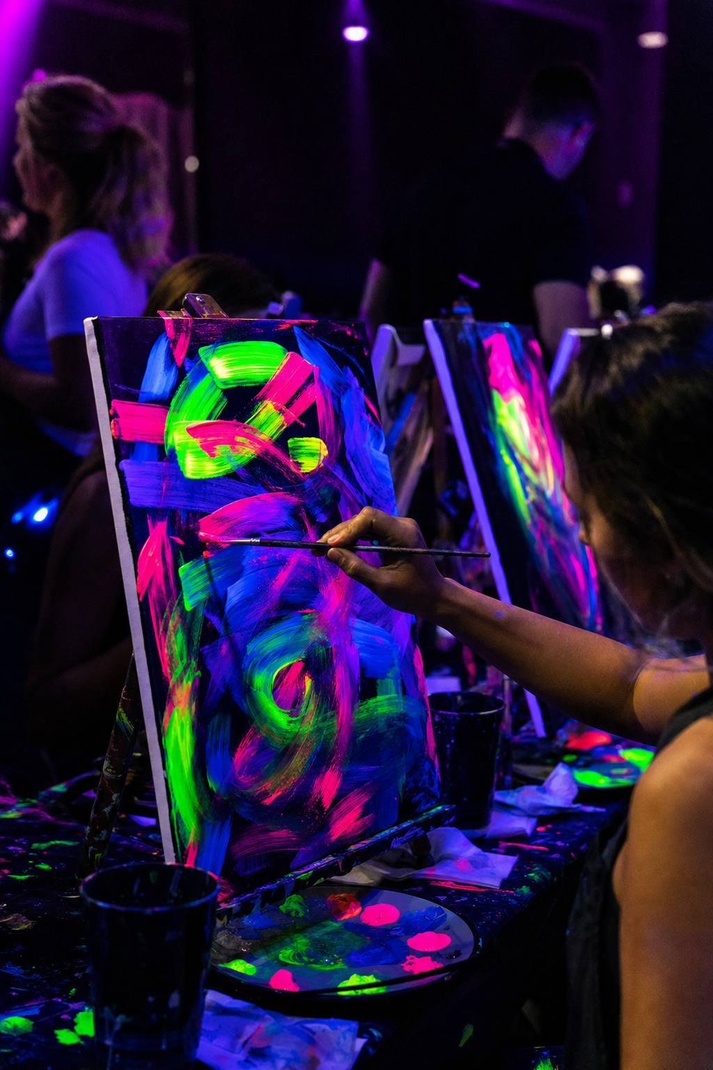 Close up of a glowing finished canvas being painted